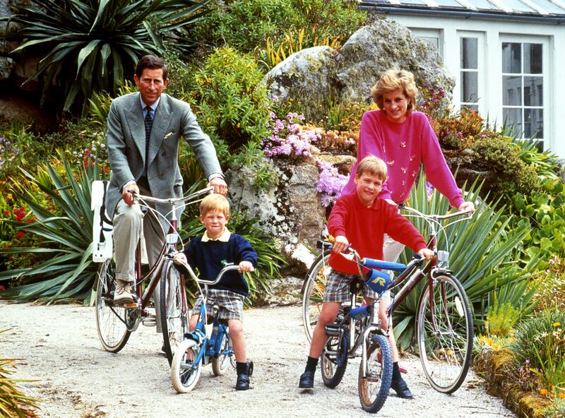 The Prince and Princess of Wales with sons Prince William, right, and Prince Harry prepare for a cycling trip in Tresco during their holiday in the Sicily Isles,  June 1, 1989