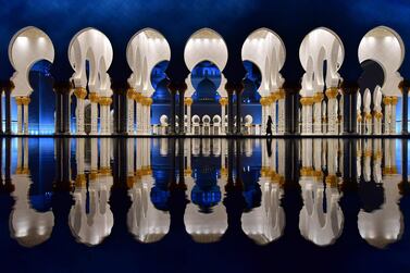 The courtyard of the Sheikh Zayed Grand Mosque in Abu Dhabi at night. The mosque opened to the public on December 20, 2007 Giuseppe Cacace / AFP Photo