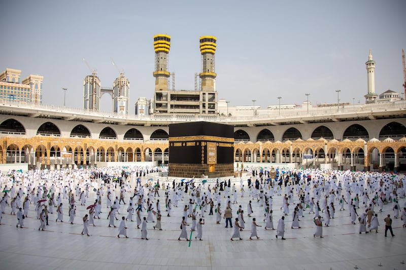 epa08577935 A handout photo made available by the Saudi Ministry of Media shows pilgrims praying during the Tawaf Al-Ifadah during the symbolic ritual of 'Stoning the Devil', throwing seven pebbles at the largest of the three pillars, known as Jamrat Al-Aqaba on the third day of Hajj 2020 in Mina,  in Mecca, Saudi Arabia, 31 July 2020. A limited number of pilgrims of citizens and residents of Saudi Arabia began the Hajj rituals on 29 July amid strict preventative health measures taken by the Saudi authorities to ensure that pilgrims are free of COVID-19 Coronavirus.  EPA/SAUDI MINISTRY OF MEDIA HANDOUT  HANDOUT EDITORIAL USE ONLY/NO SALES