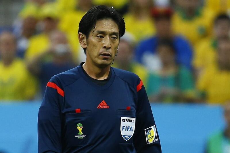 Japanese referee Yuichi Nishimura shown during Thursday night's World Cup opening match between Brazil and Croatia. Nishimura awarded a controversial penalty to Brazil that Neymar converted for the eventual winner. Kai Pfaffenbach / Reuters / June 12, 2014