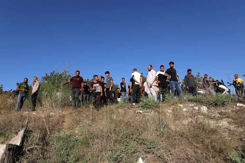 People inspect the site where three Palestinians were killed by Israeli troops near Jenin in the occupied West Bank. EPA