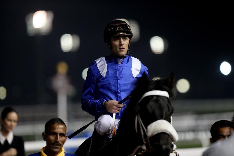 Jockey Christophe Soumillon riding Mujaarib wins the Race 5 Al Rashidiya at the Meydan Racecourse in Dubai on January 30, 2014. Satish Kumar / The National