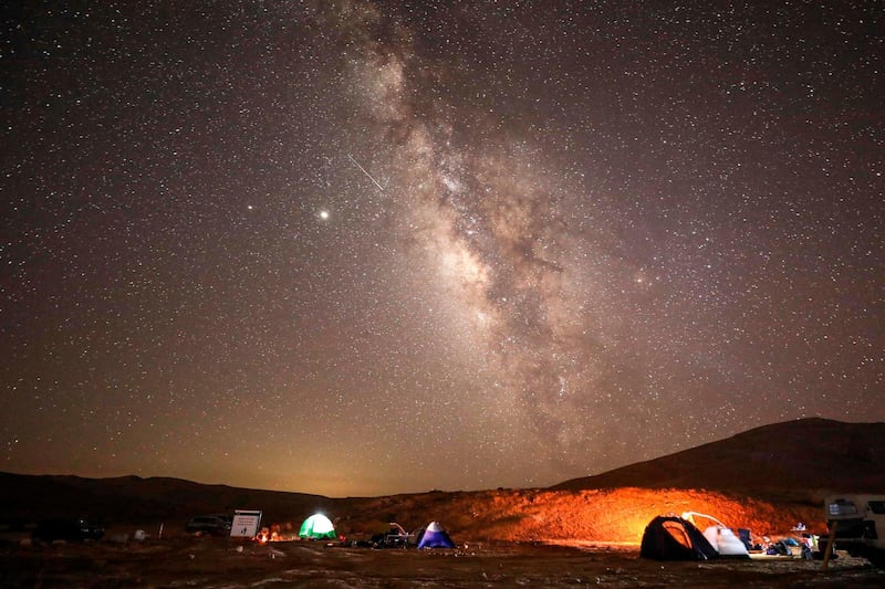 The Perseids meteor showers were more visible in other parts of the world. Here are the meteors flying across the sky above a camping site at the Negev desert in Israel.  AFP