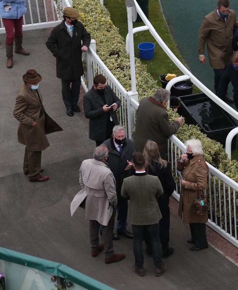 Co-owner Alex Ferguson ater his horse Protektorat, ridden by Harry Skelton, won the Novices' Chase. Reuters