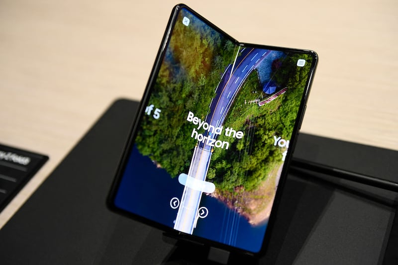 The Samsung Galaxy Z Fold was first unveiled in March 2019. It opened out horizontally to create a 7.3-inch tablet-style screen. AFP