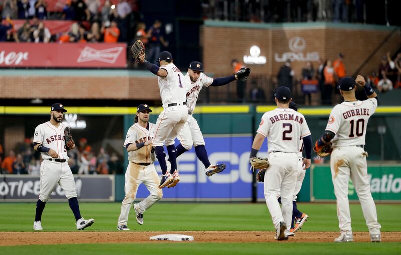Members of the Houston Astros celebrate after their win against the Los Angeles Dodgers during Game 3 of baseball's World Series Friday, Oct. 27, 2017, in Houston. The Astros won 5-3 to take a 2-1 lead in the series. (AP Photo/Matt Slocum)