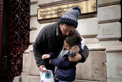 Richard Ratcliffe, husband of Nazanin Zaghari-Ratcliffe, with their daughter Gabriella, in London.  AP