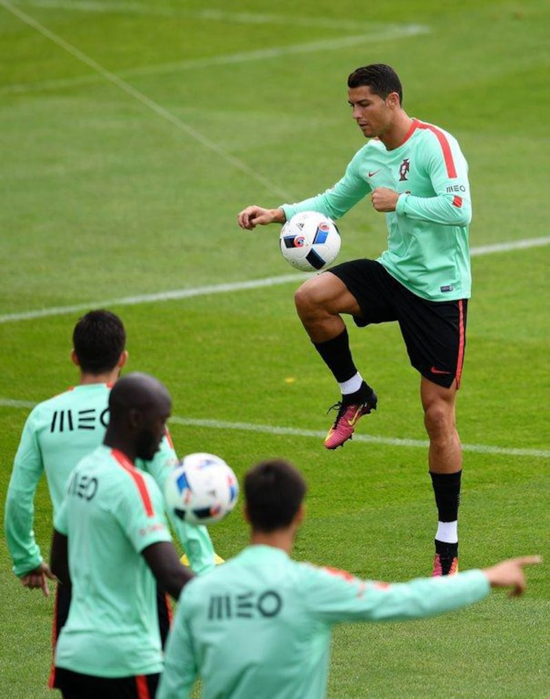 Portugal's forward Cristiano Ronaldo takes part in a training session at the team's base camp in Marcoussis, south of Paris, on June 16, 2016, during the Euro 2016 football tournament. / AFP / FRANCISCO LEONG