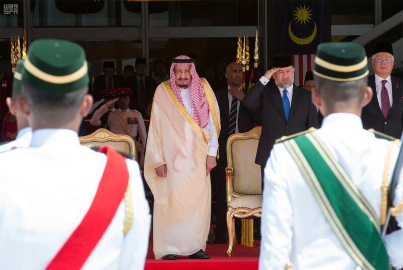 Saudi Arabia’s King Salman, centre, reviewing the honour guard with Malaysia’s King Muhammad V and Malaysia’s prime minister Najib Razak, far right, during a welcome ceremony in Kuala Lumpur, Malaysia on February 26, 2017. Saudi Press Agency/Handout via Reuters