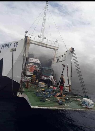 epa07798649 A handout photo made available by the Zamboanga Del Norte Police Command (ZDNPC) shows the ill-fated m/v Lite Ferry 16 at a seaport in Dipolog city, Philippines, 28 August 2019. According to Philippine Coast Guard (PCG)-Cebu Station Deputy Commander Alvin Dagalea, three passengers were killed and 23 are still missing, on August 27, when a fire broke out in the engine room of a passenger ferry from Cebu as it traveled toward Dapitan City, Zamboanga del Norte. More than 200 passengers of the ill-fated m/v Lite Ferry 16 were rescued.  EPA/ZDNPC / HANDOUT  HANDOUT EDITORIAL USE ONLY/NO SALES