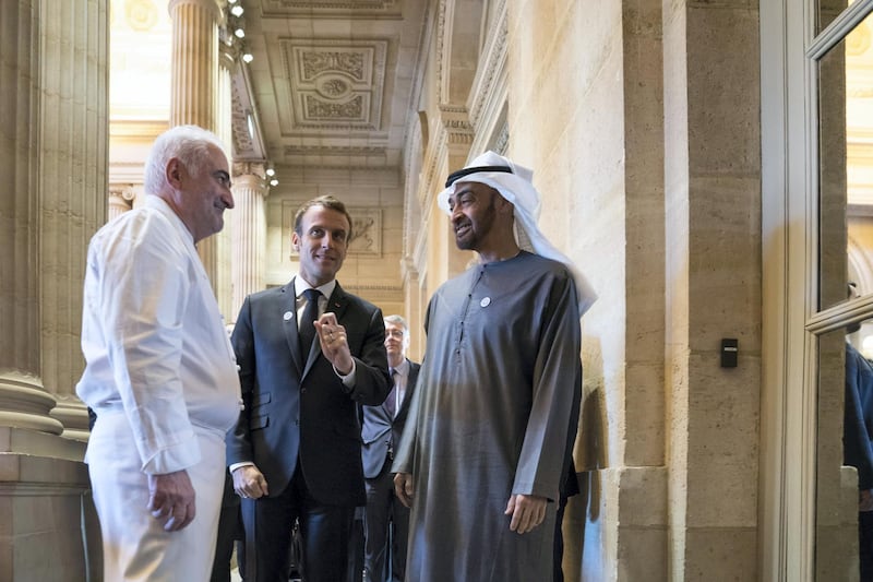 PARIS, FRANCE -November 21, 2018: HH Sheikh Mohamed bin Zayed Al Nahyan, Crown Prince of Abu Dhabi and Deputy Supreme Commander of the UAE Armed Forces (R) is received by HE Emmanuel Macron, President of France (C), commencing a business visit.

( Mohamed Al Hammadi / Ministry of Presidential Affairs )
---