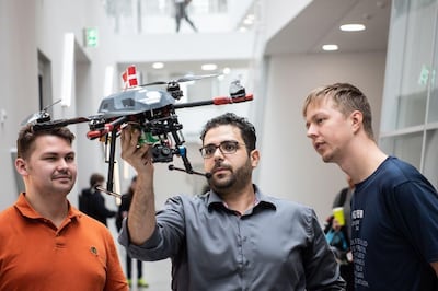 Associate Professor Emad Samuel Malki Ebeid (centre) with two students. University of Southern Denmark