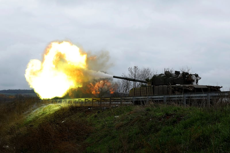 A Ukrainian tank crew fires a round from their T80 that was captured from Russians during a battle in Trostyanets in March. Russian forces are push towards Bakhmut in the eastern Donbas region of Ukraine. Reuters