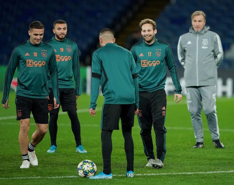 Dusan Tadic, Daley Blind and Ajax teammates take part in a training session at Stamford Bridge. PA
