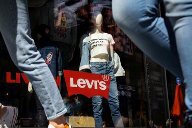 People pass by a Levi Strauss store in New York City, US. The jeans maker Levi priced its IPO at $17 share, just above its target range of $14 to $16. Photo: Reuters