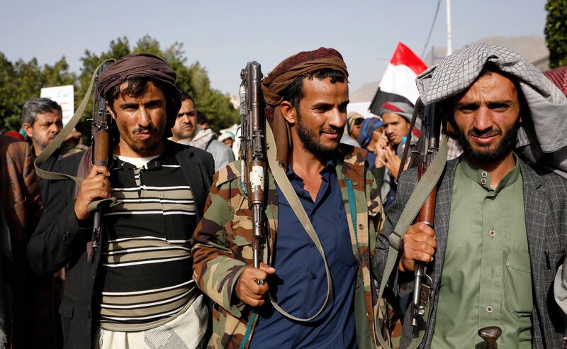 Houthis take part in a protest in Sanaa to mark the seventh anniversary of the Saudi-led military coalition in Yemen. The leadership of the Iran-backed rebel group refuses to participate in a ceasefire called by Saudi Arabia. EPA