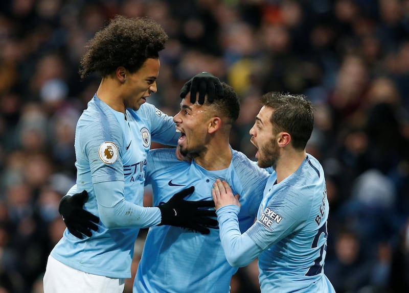 Manchester City's Jesus celebrates scoring their first goal with Leroy Sane and Bernardo Silva. Reuters