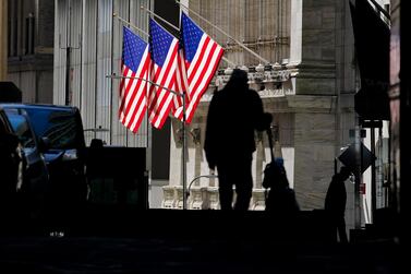 Pedestrians pass the New York Stock Exchange in New York. With US President-elect Joe Biden now controlling US Senate, analysts say this should free him to inject further stimulus into the US economy, which should drive growth and inflation.