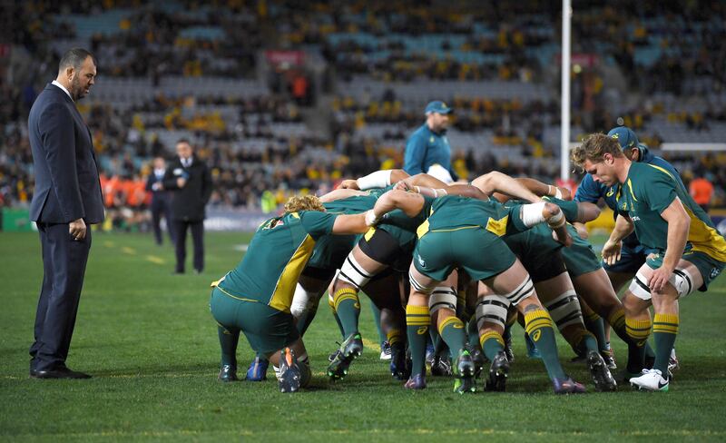 epa06151047 Australia head coach Michael Cheika (L) watches his players warm up before game 1 of the Bledisloe Cup between the Australian Wallabies and the New Zealand All Blacks at ANZ Stadium in Sydney, Australia, 19 August 2017.  EPA/DAVID MOIR  AUSTRALIA AND NEW ZEALAND OUT