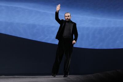 Mohammed Ashi salutes the audience at the finale of the Ashi Studio Couture Spring/Summer 2023. Getty Images 