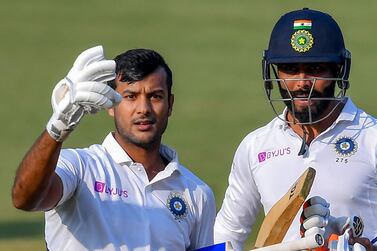 India's Mayank Agarwal (L) flashes two fingers after scoring a double-century (200 runs) as teammate Ravindra Jadeja looks on during the second day of the first Test cricket match of a two-match series between India and Bangladesh at Holkar Cricket Stadium in Indore on November 15, 2019. - ----IMAGE RESTRICTED TO EDITORIAL USE - STRICTLY NO COMMERCIAL USE----- / GETTYOUT / AFP / Indranil MUKHERJEE / ----IMAGE RESTRICTED TO EDITORIAL USE - STRICTLY NO COMMERCIAL USE----- / GETTYOUT