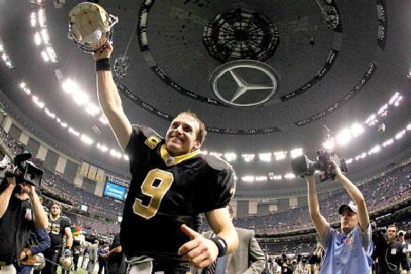 All is right in the world of Drew Brees, whose team in on the verge of clinching the No 2 seed in the NFC and who just collected a single-season passing record in helping them get there.
