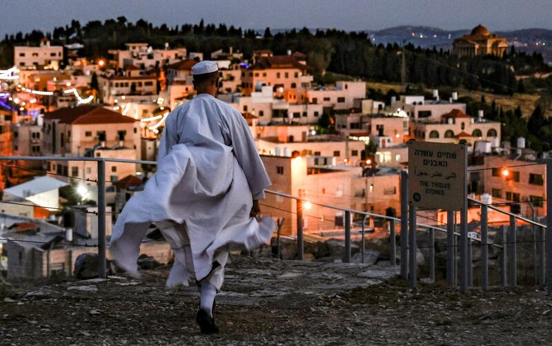A Samaritan worshipper arrives to take part in a Passover ceremony on top of Mount Gerizim, near the northern West Bank town of Nablus. AFP