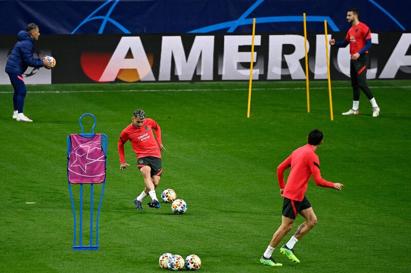 Atletico Madrid players take part in a training session. AFP