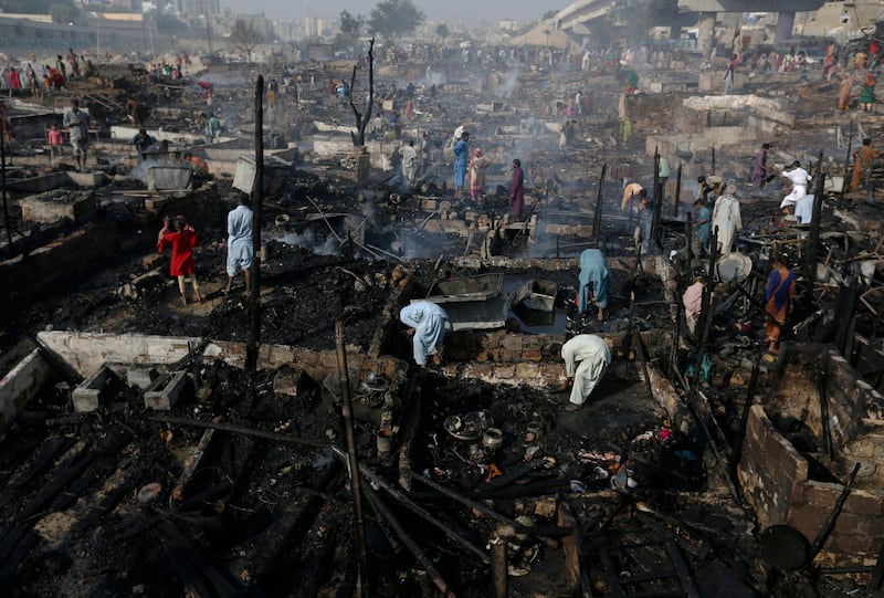 The fire destroyed about 100 huts but no-one was injured. AP Photo