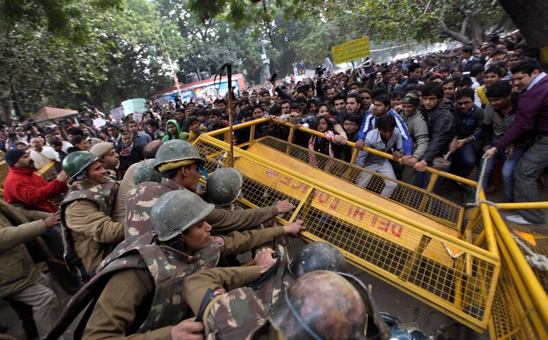 Members of the student wing of India’s main opposition Bharatiya Janata Party try to break through a police cordon during a protest after the death of a young woman who was recently gang-raped in a moving bus in New Delhi, India, Sunday, Dec. 30, 2012. The woman who died after being gang-raped and beaten on a bus in India's capital was cremated Sunday amid an outpouring of anger and grief by millions across the country demanding greater protection for women from sexual violence. (AP Photo/Altaf Qadri) *** Local Caption ***  India Gang Rape.JPEG-0dc35.jpg