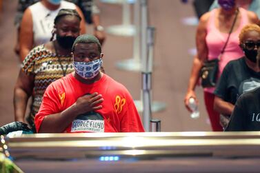 Mourners visit the casket of George Floyd during a public visitation Monday, June 8, 2020, at The Fountain of Praise church in Houston. Floyd died after being restrained by Minneapolis Police officers on May 25. AFP 