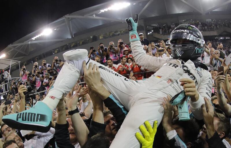 Nico Rosberg celebrates with his team after winning the Formula One World Drivers' Championship. Valdrin Xhemaj / EPA EPA/VALDRIN XHEMAJ