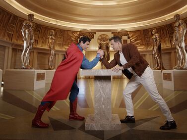 Ryan Reynolds takes on Superman in an arm wrestling match at Warner Bros World Abu Dhabi. Photo: Yas Island / Miral