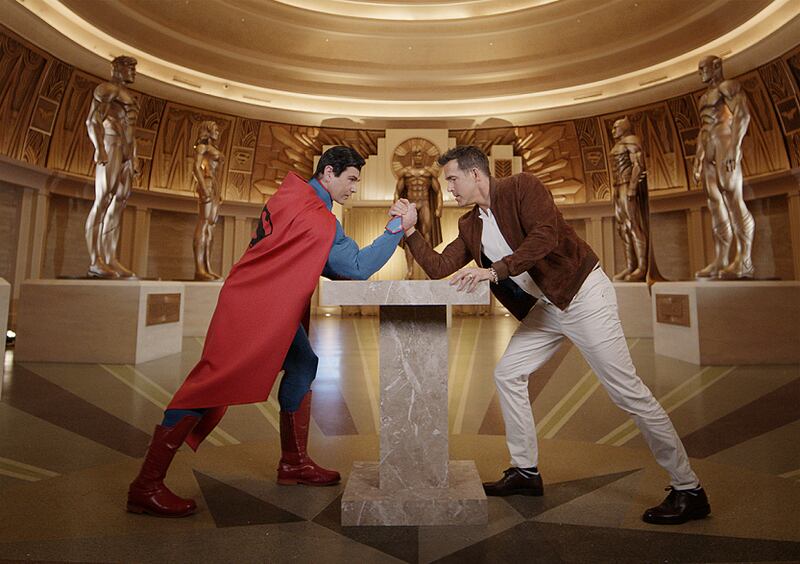 Ryan Reynolds takes on Superman in an arm wrestling match at Warner Bros World Abu Dhabi. Photo: Yas Island / Miral