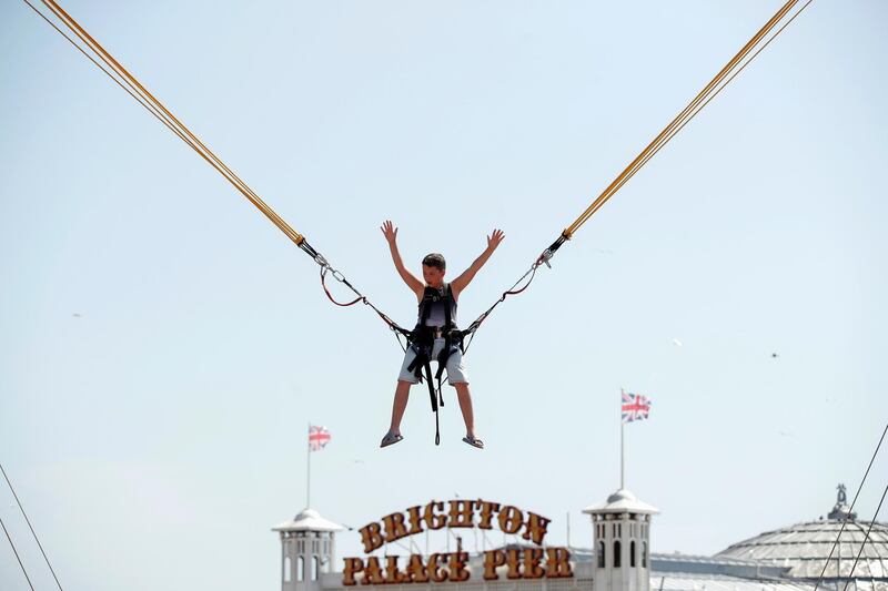 A child jumps on a trampoline at Brighton's Palace Pier in Britain. Reuters