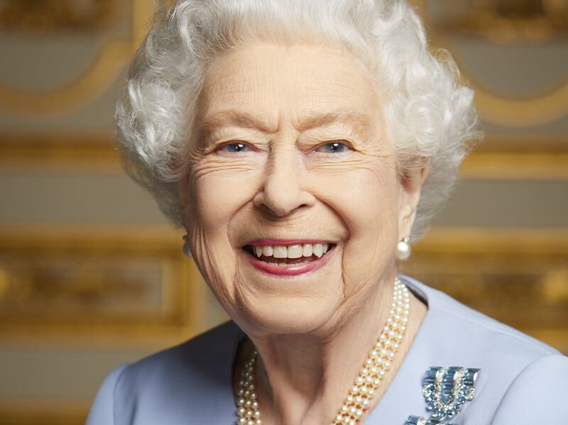On the eve of her funeral, Buckingham Palace released this previously unseen portrait of Queen Elizabeth II smiling with joy. Here 'The National' takes a look back at previous portraits of the queen. PA