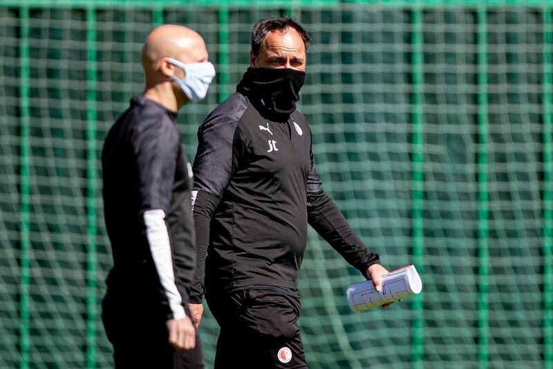Slavia Prague manager Jindrich Trpisovsky, right, during training on Monday. EPA
