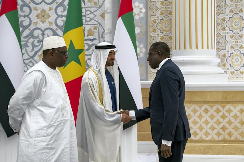 ABU DHABI, UNITED ARAB EMIRATES - February 06, 2020: HH Sheikh Mohamed bin Zayed Al Nahyan, Crown Prince of Abu Dhabi and Deputy Supreme Commander of the UAE Armed Forces (C) greets a member of the Senegalese delegation accompanying HE Macky Sall, President of Senegal (L), during an official visit reception, at Qasr Al Watan.

( Hamad Al Kaabi / Ministry of Presidential Affairs )​
---