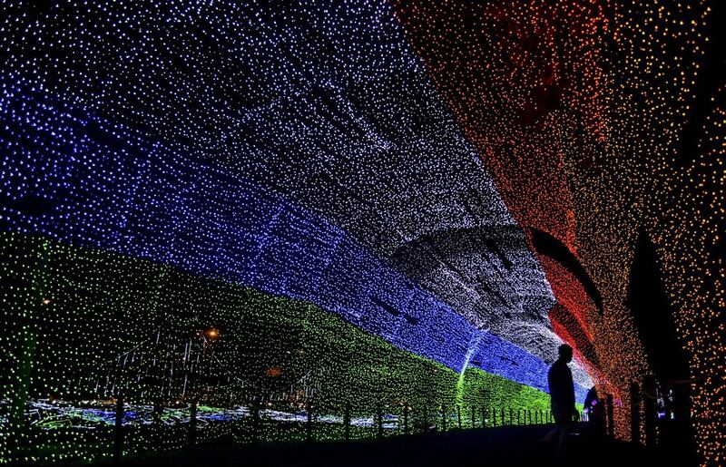 Christmas lights illuminate the Medellin River in Medellin, Antioquia department, Colombia. Raul Arboleda / AFP 