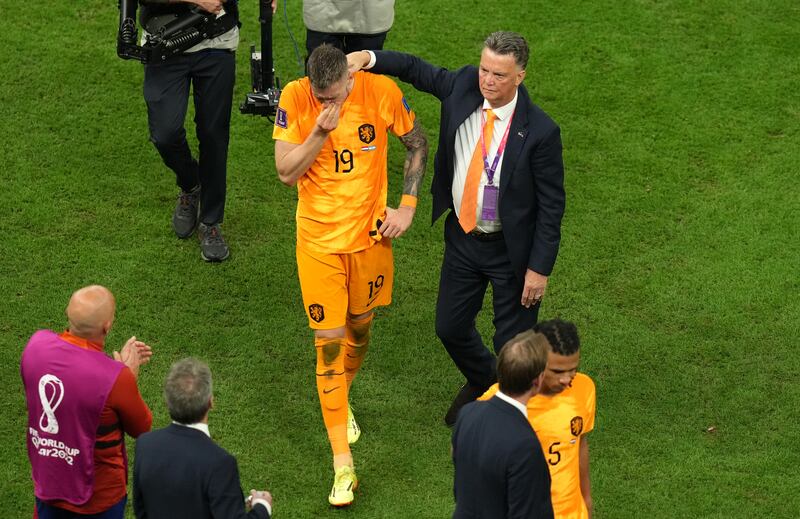Netherlands manager Louis van Gaal consoles Wout Weghorst after their defeat in the penalty shoot-out against Argentina. PA