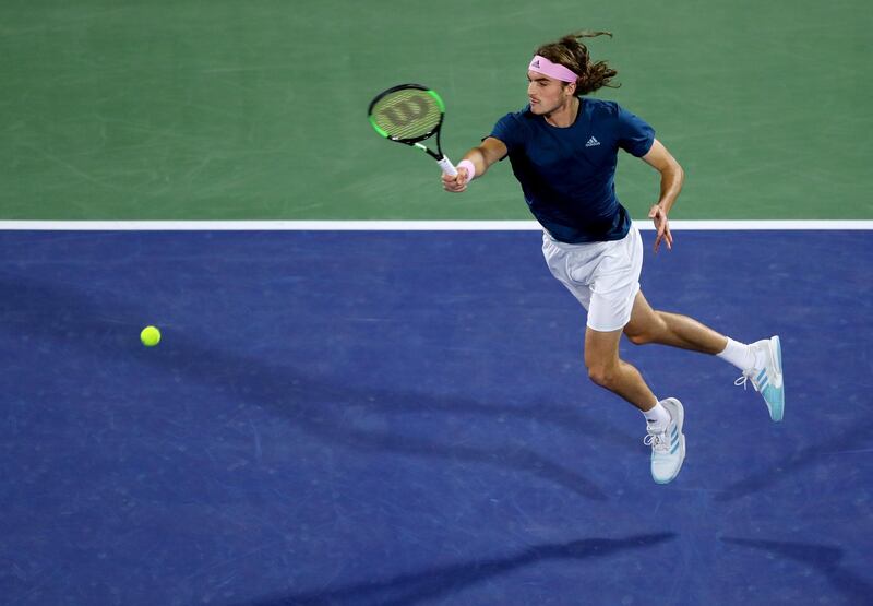 Tsitsipas plays a shot as he tries to put Federer under pressure. Getty