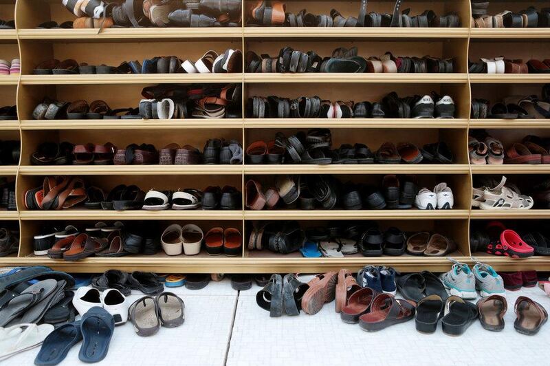 Footwear is stored before Eid prayers. Christopher Pike / The National