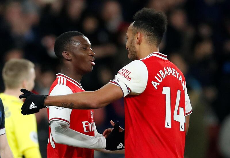 Arsenal's Pierre-Emerick Aubameyang celebrates with Eddie Nketiah after the match. Reuters