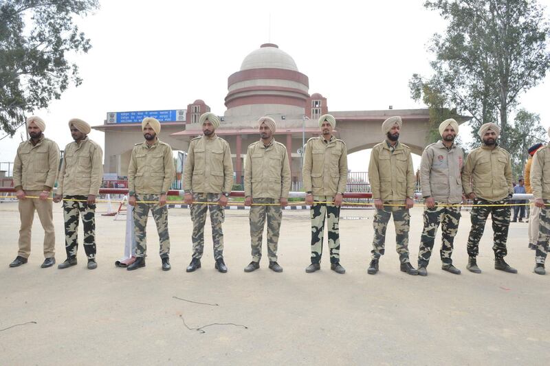 Indian police stand guard near the crossing. AFP