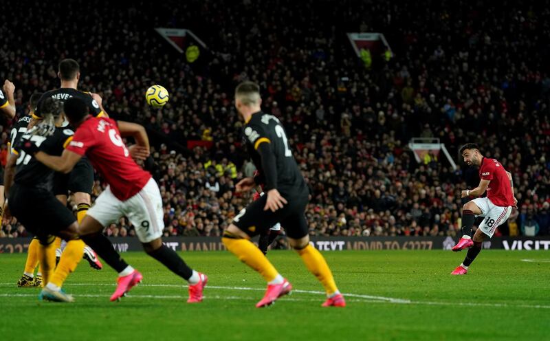 Bruno Fernandes, right, shoots at goal on his Manchester United debut in the 0-0 draw against Wolves at Old Trafford. Reuters