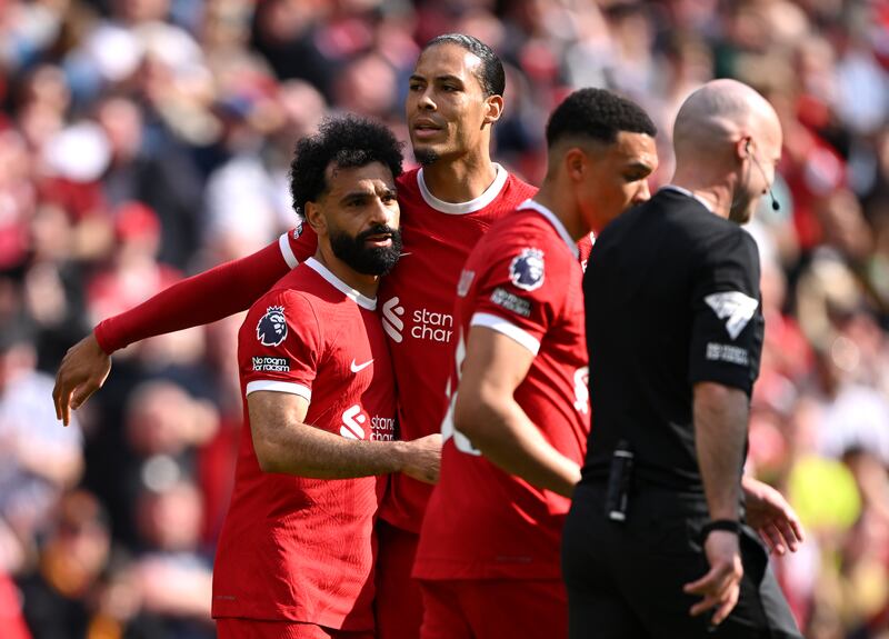 Mohamed Salah of Liverpool celebrates with teammate Virgil van Dijk after scoring his team's first goal in their 4-2 Premier League win against Tottenham Hotspur at Anfield on Sunday, May 5, 2024. Getty Images