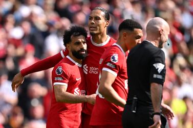 LIVERPOOL, ENGLAND - MAY 05: Mohamed Salah of Liverpool celebrates scoring his team's first goal with teammate Virgil van Dijk during the Premier League match between Liverpool FC and Tottenham Hotspur at Anfield on May 05, 2024 in Liverpool, England. (Photo by Stu Forster / Getty Images)