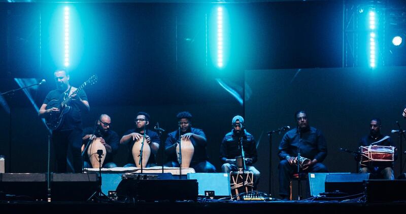 Guitarist Ghazi Al Mulaifi, far left, leads the group Boom.Diwan as they play Kuwaiti pearl diving songs. Courtesy NYU Abu Dhabi Arts Centre