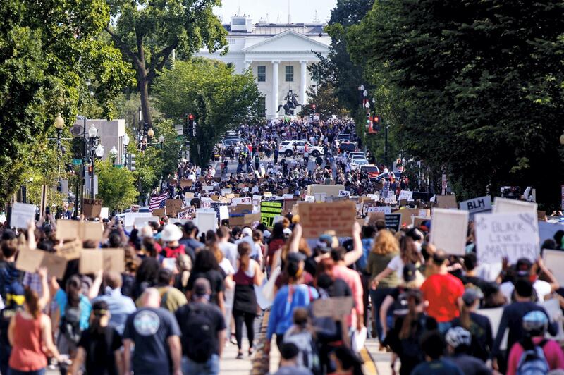 epa08461507 People, who gathered in protest of the death of George Floyd, peacefully march to the White House in Washington, DC, USA, 02 June 2020. A bystander's video posted online on 25 May, shows George Floyd, 46, pleading with arresting officers that he couldn't breathe as one officer knelt on his neck. The unarmed black man soon became unresponsive, and was later pronounced dead. According to news reports on 29 May, Derek Chauvin, the police officer in the center of the incident has been taken into custody and charged with murder in the George Floyd killin  EPA-EFE/SHAWN THEW *** Local Caption *** 56127115