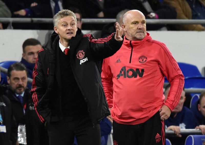 Solskjaer with assistant coach Mike Phelan. Reuters